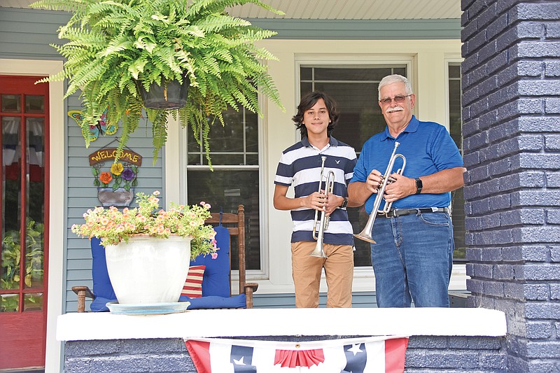 Gabriel Avila, left, and his grandfather, Richard Niven, of Dardanelle, answered a call put out by CBS News for Taps Across America to join thousands of buglers and trumpeters across the country in playing taps from their front porches, kicking off a socially distant 100 Nights of Taps on the National Day of Remembrance.