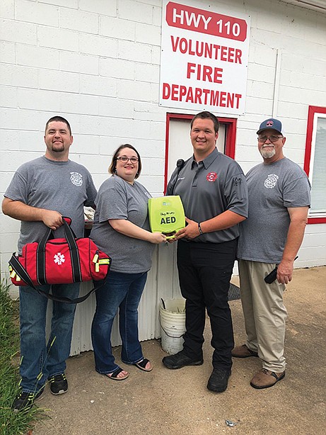 The Highway 110 Volunteer Fire Department in Clinton will host a free Community Drive-Thru Meal from 11 a.m. to 1 p.m. Saturday. From left are Assistant Chief David Lowrance, firefighter Nancy Lowrance, firefighter Clint Bagley and Chief Danny Bagley.