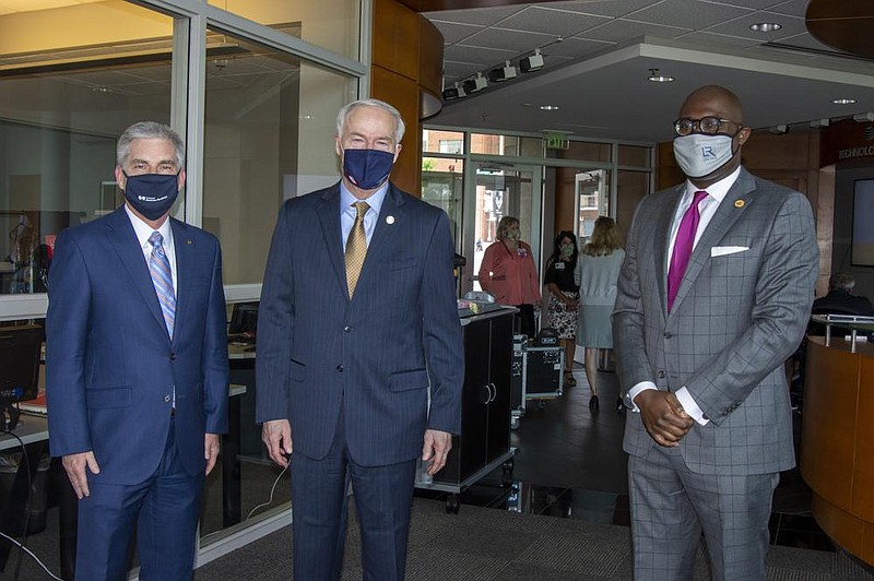 Curtis Barnett, CEO of Arkansas Blue Cross Blue Shield, Gov. Asa Hutchinson  and Little Rock Mayor Frank Scott
 (Arkansas Democrat-Gazette/Cary Jenkins)