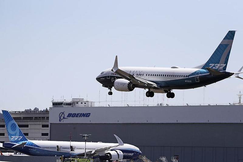 A Boeing 737 MAX jet heads to a landing at Boeing Field in Seattle after a test flight Monday, the start of three days of re-certification test flights in a step toward returning the aircraft to passenger service.
(AP/Elaine Thompson)