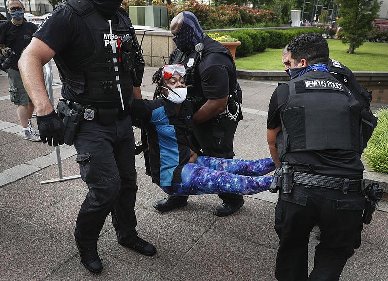 Police arrest an activist Wednesday outside City Hall in Memphis, where multiple protesters have been camping out for weeks to demand police changes.
(AP/Daily Memphian/Mark Weber)