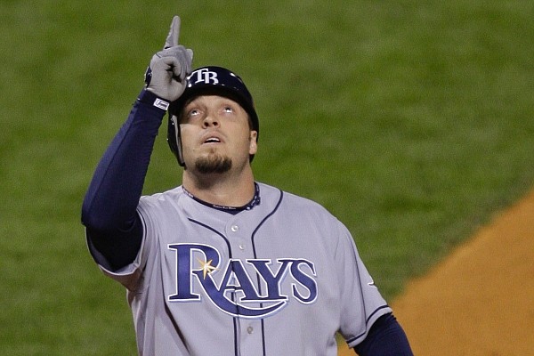 Tampa Bay Rays' Eric Hinske points up to the sky as he crosses home after hitting a home run during the fifth inning of Game 4 of the baseball World Series against the Philadelphia Phillies in Philadelphia, Sunday, Oct. 26, 2008. (AP Photo/Julie Jacobson)