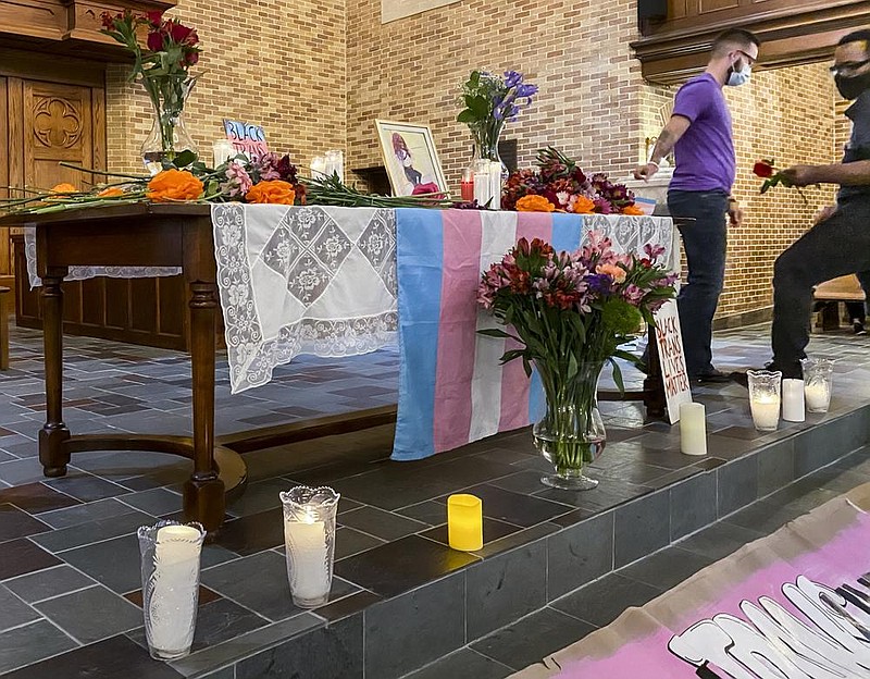 Flowers are placed on a memorial for Brayla Stone, 17, during a nighttime candlelight vigil Monday, June 29, 2020, at First Presbyterian Church in Little Rock. The North Little Rock teenager was found dead June 25 in a vehicle parked on a walking path in Sherwood.