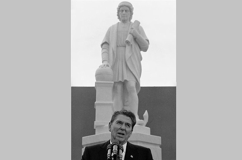 President Ronald Reagan helps unveil a statue of Christopher Columbus during a ceremony in Baltimore in this Oct. 9, 1984, file photo. The statue was toppled and tossed into a harbor on Saturday, July 4, 2020.