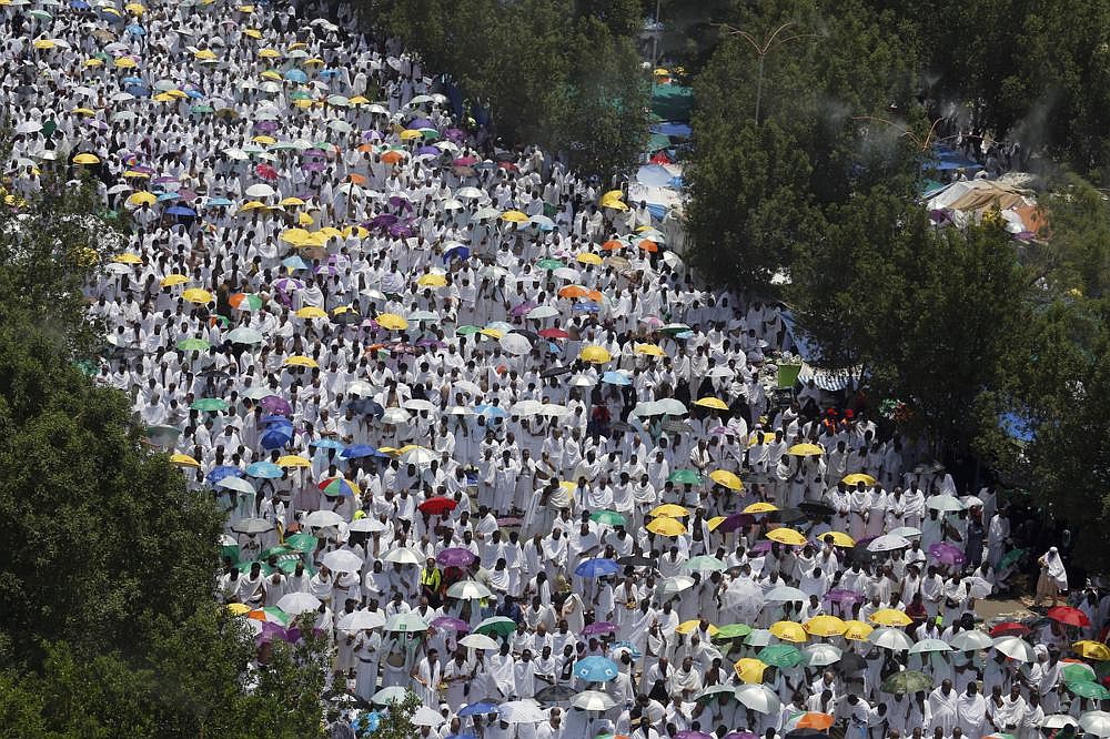 Hundreds of thousands of Muslim pilgrims pray outside Namira Mosque in Arafat during the annual hajj pilgrimage in August, near the holy city of Mecca, Saudi Arabia. The kingdom’s recent announcement that only around 1,000 people would be allowed to perform the pilgrimage dealt a blow to travel agencies specializing in facilitating trips to Mecca and pilgrims alike.
(AP/Amr Nabil)