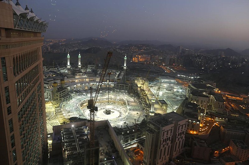 The sun sets at the site of the Grand Mosque, in the Muslim holy city of Mecca, Saudi Arabia, in March as authorities emptied Islam’s holiest site for sterilization because of the covid-19 pandemic. Adherents of the Muslim faith who are physically and fi nancially able to make the pilgrimage must do so at least once, and the recent announcement that only 1,000 pilgrims who reside in the kingdom would be permitted to make the journey this year has millions experiencing sadness and a sense of spiritual loss.
(AP/Amr Nabil)