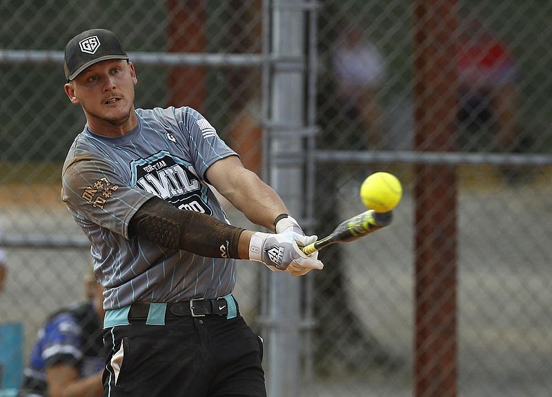 A grand slam by Greenspace/Nally’s Colton Leet was one of mul- tiple home runs the team used to defeat Vivid/FBI 38-23 in five innings to win the Men’s Major Division championship of the Bus- ch Softball Classic on Sunday at the Sherwood Sports Complex. See more photos at www.arkansasonline.com/76busch/ (Arkansas Democrat-Gazette/Thomas Metthe) 