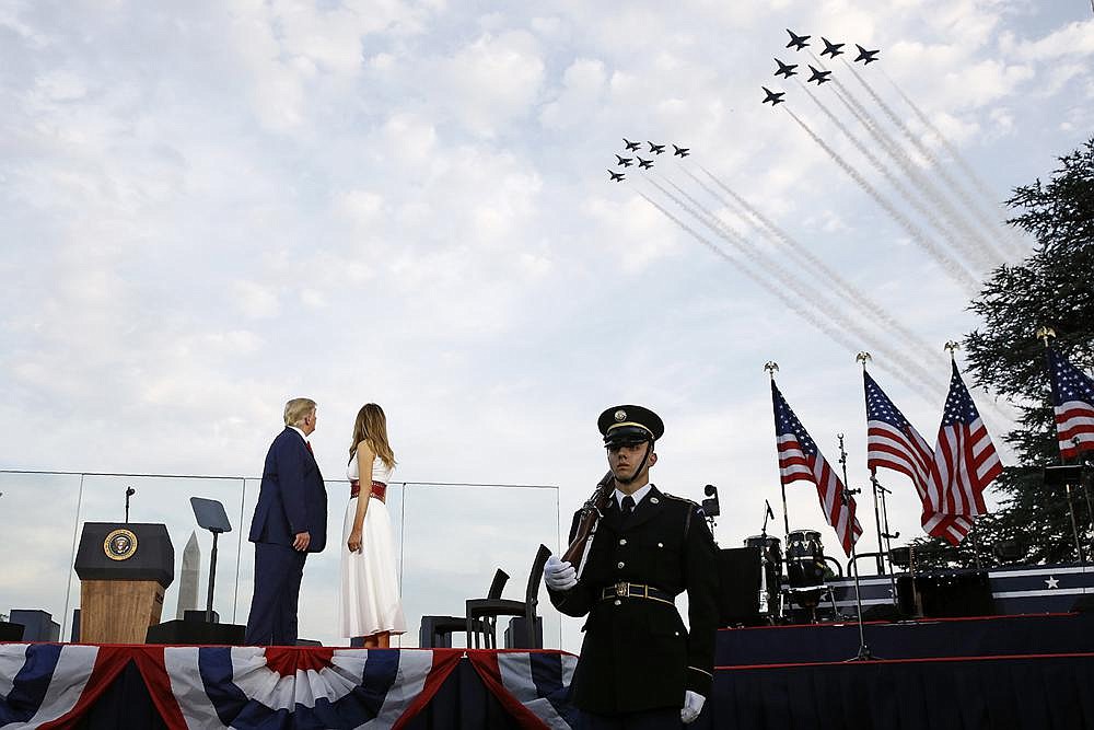 President Donald Trump and fi rst lady Melania Trump watch Saturday as the U.S. Air Force Thunderbirds and U.S. Navy Blue Angels perform a flyover during a “Salute to America” event on the South Lawn of the White House. (AP/Patrick Semansky)