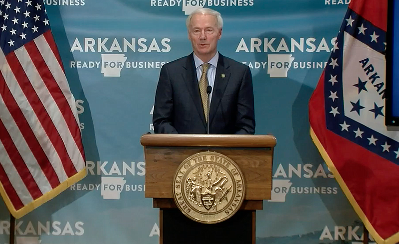 Arkansas Gov. Asa Hutchinson speaks to reporters at the state Capitol in Little Rock on Monday in this still of video provided by the governor's office. 