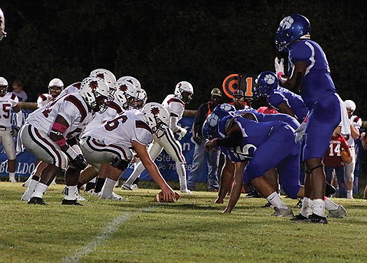 Caleb Slinkard/News-Times In this file photo, Strong's defense lines up for a play during their 8-2A clash against Fordyce at Jerry Burson Field during the 2019 season. With the end of the dead period, the Bulldogs began summer workouts on Monday.