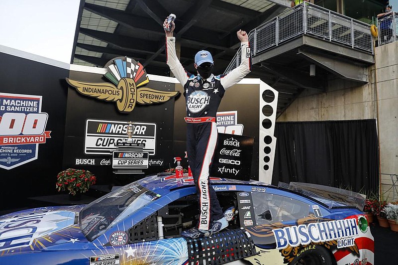 Kevin Harvick celebrates after winning Sunday’s NASCAR Cup Series race at Indianapolis Motor Speedway. Harvick won for the 53rd time to move within one of tying Lee Petty for 11th on NASCAR’s career list. More photos at arkansasonline.com/76nascar/ 
(AP/Darron Cummings) 
