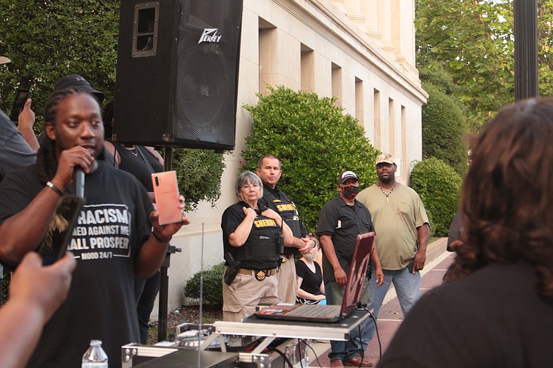 A police presence from the Union County Sheriff's Office and El Dorado Police Department was seen during a protest at the Union County Courthouse on Monday, June 6. (Caitlan Butler/News-Times)