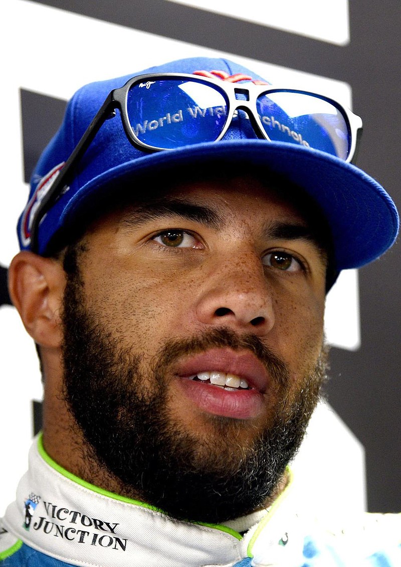 Bubba Wallace answers question during a media availability for Sunday's NASCAR Cup Series auto race, Saturday, July 27, 2019, in Long Pond, Pa. (AP Photo/Derik Hamilton)