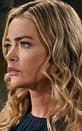 In this March 8, 2019 photo released by CBS, Katrina Bowden, left, and Denise Richards appear in a scene from the daytime series "The Bold and the Beautiful." Richards returns to work on the CBS soap opera after production had been shut down for three months due to the outbreak of COVID-19. The series is one of the first U.S. productions to resume filming. (Cliff Lipson/CBS via AP)