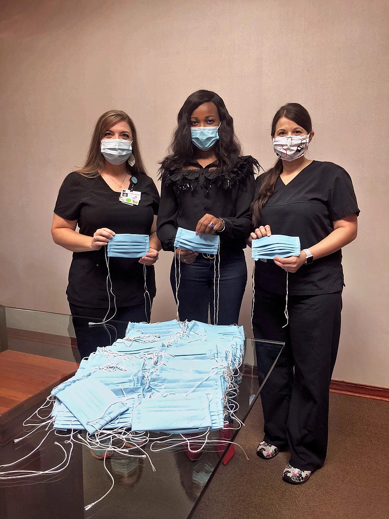 (from left to right) Constance Farris, RNC-OB; Ezinne Nwude, MD, MPH, FACP, co-owner Gold Cross Urgent Care; and Cassey Simons, RNC-OB, prepare for mask distribution to community starting July 13 at Gold Cross Urgent Care. Masks will be distributed on a first-come, first-served basis from 4 to 6 p.m. Monday through Friday. Farris and Simons made and donated the masks. (Contributed)