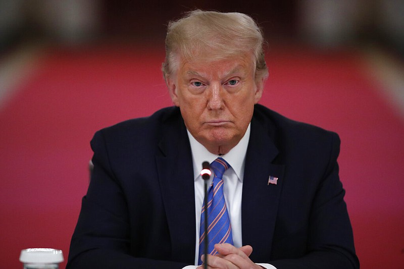 President Donald Trump listens during a "National Dialogue on Safely Reopening America's Schools," event in the East Room of the White House, Tuesday, July 7, 2020, in Washington.