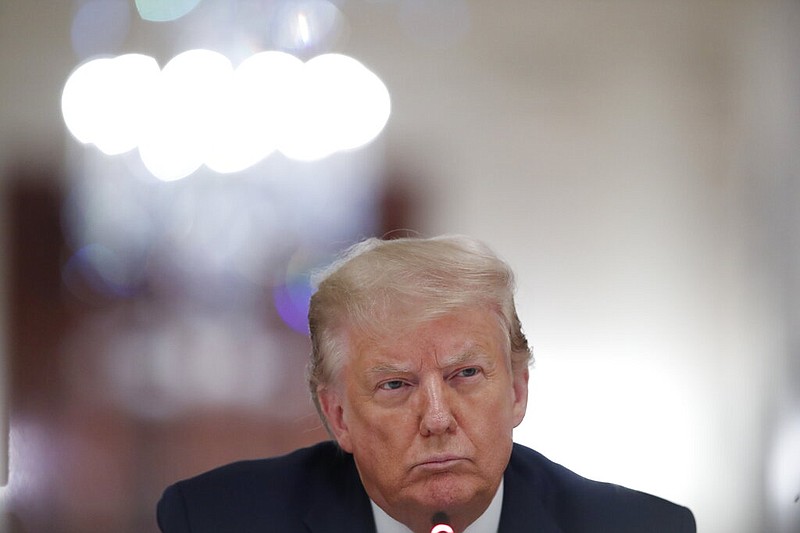 President Donald Trump listens during a "National Dialogue on Safely Reopening America's Schools," event in the East Room of the White House, Tuesday, July 7, 2020, in Washington. (AP Photo/Alex Brandon)

