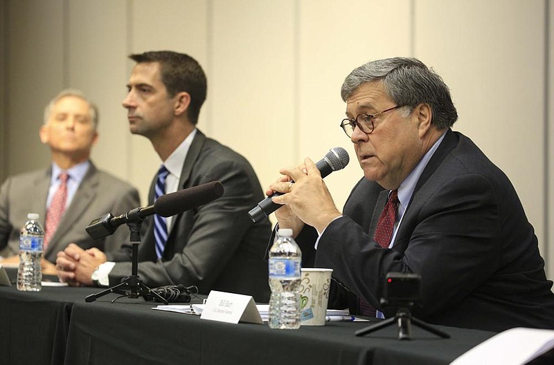 U.S. Attorney General William Barr (from right) speaks to law enforcement officials Thursday in Little Rock along with U.S. Sen. Tom Cotton and U.S. Rep. French Hill. Barr said “sort of a witch’s brew of extremists” hijacked demonstrations over police violence. More photos at arkansasonline.com/710barr/.
(Arkansas Democrat-Gazette/Staton Breidenthal)