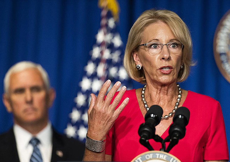 Education Secretary Betsy DeVos, at a briefing Wednesday with Vice President Mike Pence, said that anything less than a full reopening of schools would be a failure for students and taxpayers. More photos at arkansasonline.com/79devos/.
(AP/Manuel Balce Ceneta)
