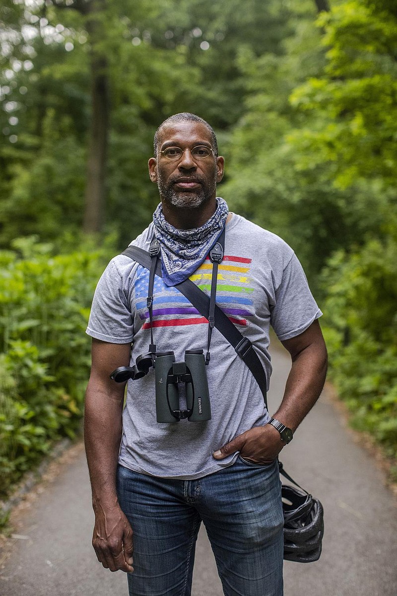 Christian Cooper, a prominent bird watcher who works in communications, in Central Park in New York, May 27, 2020. Amy Cooper, who was captured on video calling the police after Christian Cooper asked her to keep her dog on a leash in Central Park, faces a criminal charge for filing a false report, the Manhattan district attorney said on Monday, July 6. 
(Brittainy Newman/The New York Times)