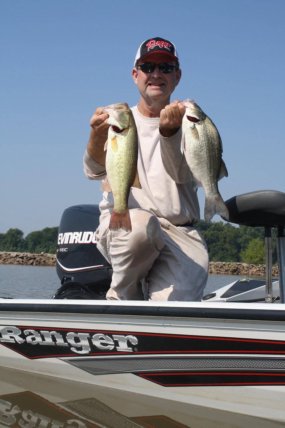 Heavy current energizes the fish in the Arkansas River, allowing George Cochran to catch chunky largemouth bass and white bass in the backwaters. (Arkansas Democrat-Gazette/Bryan Hendricks)