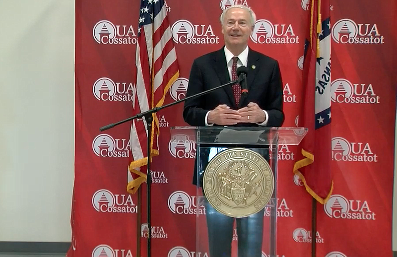 Arkansas Gov. Asa Hutchinson speaks to reporters on Friday in this still of video provided by the governor's office. 