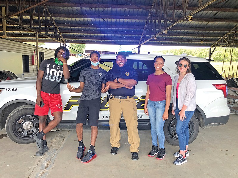 Volunteers from central Arkansas assisted the Jacksonville Police Department in making a training and informative video on the proper procedures for a traffic stop. From left are volunteers Deorius Cobbs, Timothy Jasper, Sgt. Jeffery Tillman, Myla McGhee and Tori Kiser.