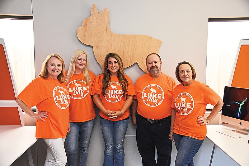 Realtors and office workers for the NextHome Realty Group in Conway are, from left, Wendy Ferguson, Sarah Keathley, Megan Sorrels, Rick Ketchum and Jennifer Barnard. NextHome Realty Group, a nationwide organization, will host Luke Day from 4-6 p.m. Wednesday at Laurel Park. They will serve free Kona Ice snow cones to children while they play at the park and splash pad.