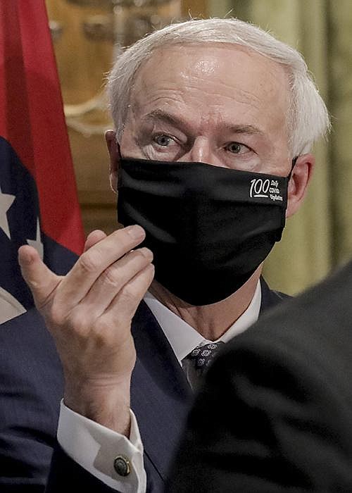 The rise in coronavirus cases “is a reminder of the work we have to do,” Gov. Asa Hutchinson said Thursday as he announced the delay in the start of school. More photos at arkansasonline.com/710gov/.
(Arkansas Democrat-Gazette/John Sykes Jr.)