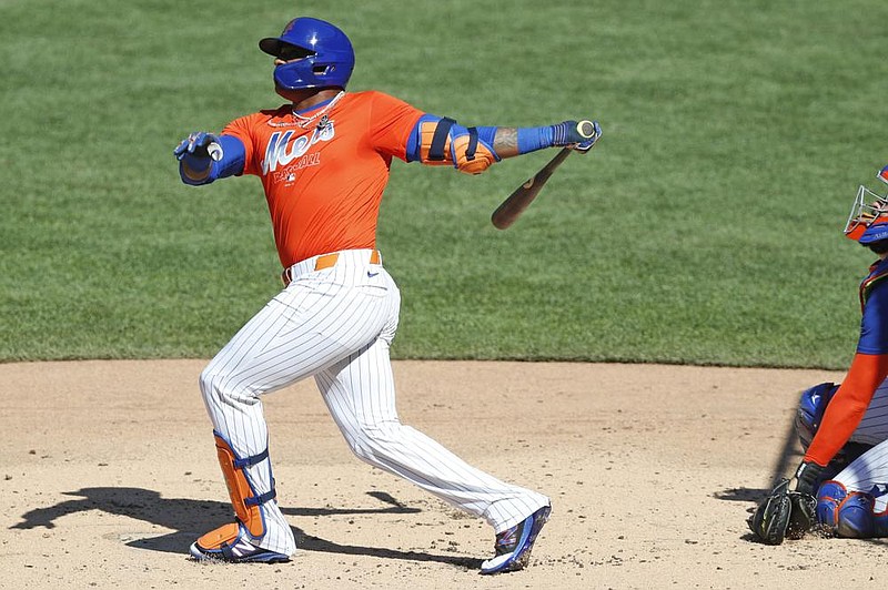 Yoenis Cespedes bats in a simulated game as part of the New York Mets’ summer baseball training camp workout Thursday at Citi Field in New York. Players are getting a taste of games without fans.
(AP/Kathy Willens)