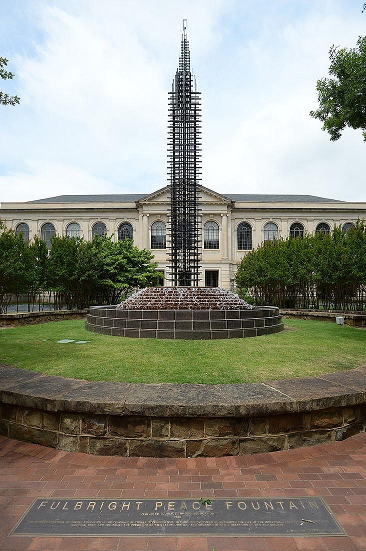 The Fulbright Peace Fountain stands July 1 near the east entrance of Vol Walker Hall on the University of Arkansas campus in Fayetteville.
(NWA Democrat-Gazette/Andy Shupe)