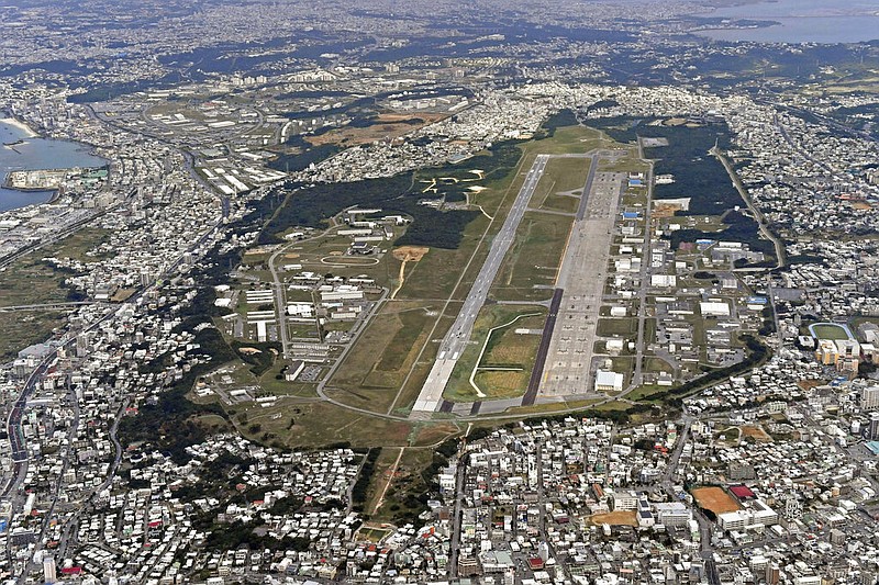 FILE - This Jan. 27, 2018, aerial file photo shows U.S. Marine Air Station Futenma in Ginowan, Okinawa, southern Japan. Okinawan officials said Saturday, July 11, 2020 that dozens of U.S. Marines have been confirmed to have infected with the coronavirus at two bases, Futenma and Camp Hansen, on the southern Japanese island in what is feared to be a massive outbreak, and demanded adequate explanation from the U.S. military officials. (Kyodo News via AP, File)