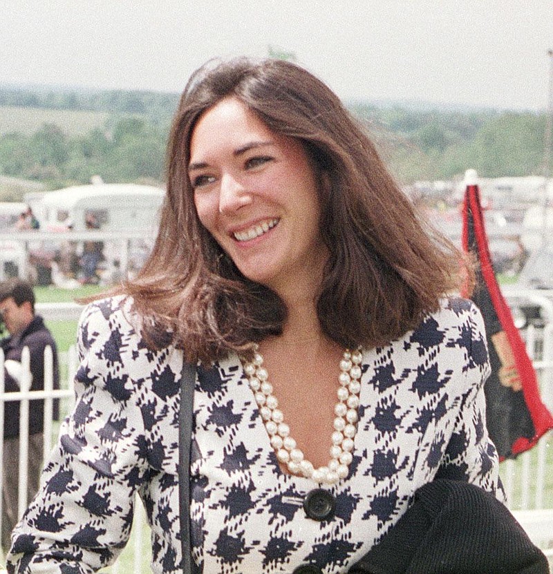 In this June 5, 1991 file photo, British socialite Ghislaine Maxwell arrives at Epsom Racecourse. 
 (Chris Ison/PA via AP, File)