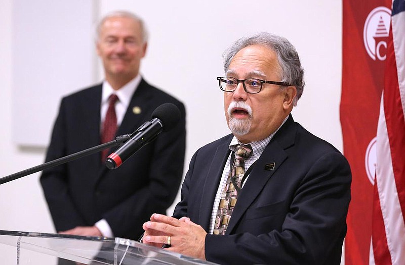 Dr. Jose Romero gives a Spanish language update on the coronavirus efforts in Arkansas during the daily briefing in De Queen. More photos at arkansasonline.com/711briefing/.
(Arkansas Democrat-Gazette/Thomas Metthe)