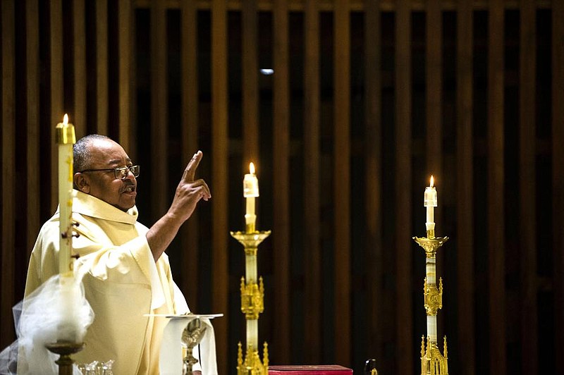 Father Warren Harvey, the bishop’s liaison for the Diocesan Council of Black Catholics, conducts a service in the chapel of Little Rock’s CHI St. Vincent Infirmary in May.
(Arkansas Democrat-Gazette/Stephen Swofford)
