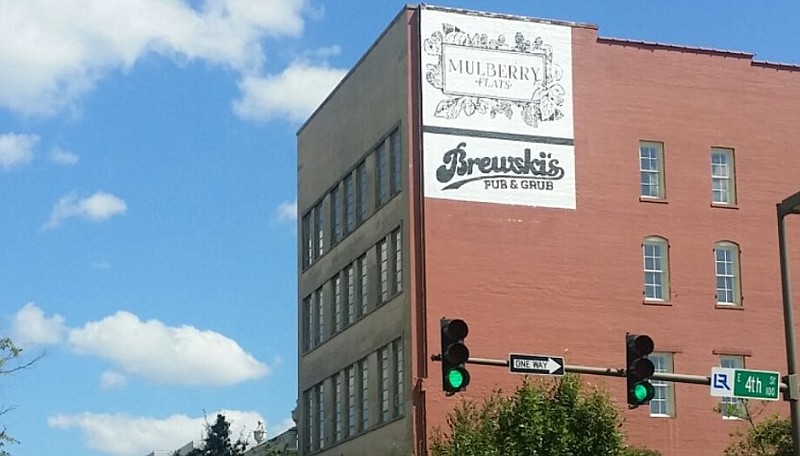 A sign for Brewski's Pub & Grub is visible on the side of the downtown Little Rock building that houses it in this September 2017 file photo.