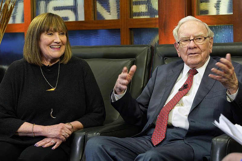 Susie Buffett, and her father, Berkshire Hathaway Chairman and CEO Warren Buffett, are inter- viewed in Omaha, Neb. in this 2018 file photo. (AP