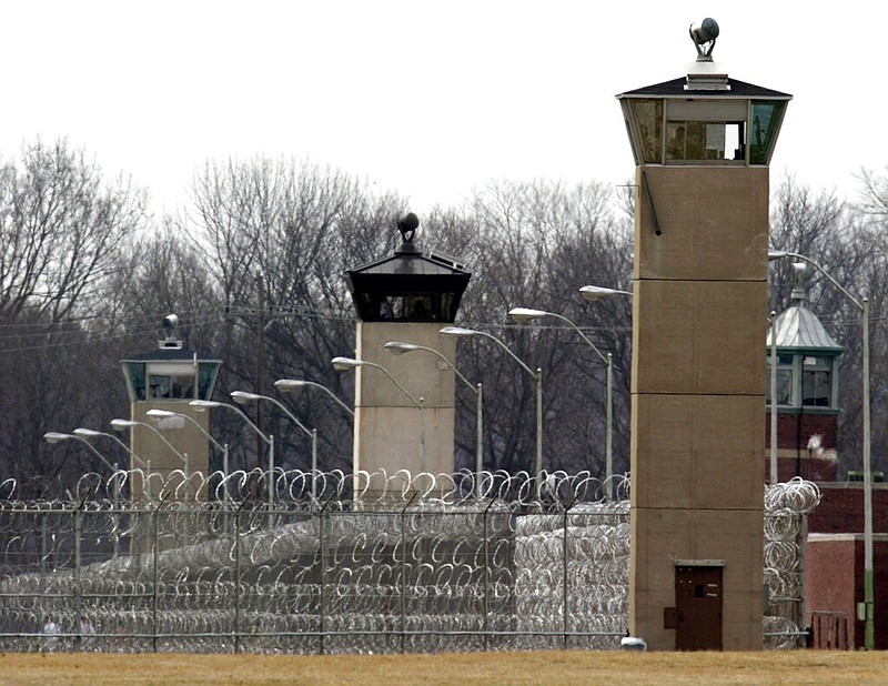 FILE - In this March 17, 2003 file photo, guard towers and razor wire ring the compound at the U.S. Penitentiary in Terre Haute, Ind., the site of the last federal execution. After the latest 17-year hiatus, the Trump administration wants to restart federal executions this month at the Terre Haute, prison. Four men are slated to die. All are accused of murdering children in cases out of Arkansas, Kansas Iowa and Missouri. (AP Photo/Michael Conroy, File)

