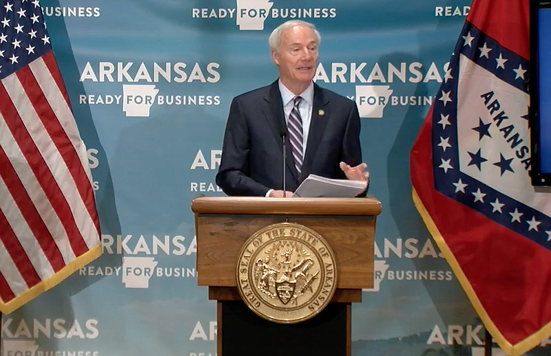 Arkansas Gov. Asa Hutchinson speaks to reporters at the state Capitol in Little Rock on Monday in this still of video provided by the governor's office. 