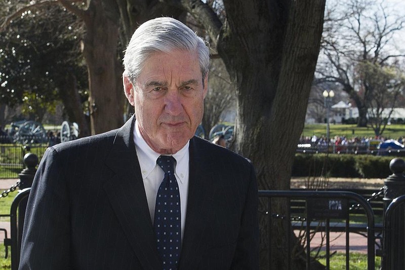 FILE - In this March 24, 2019 photo, then-special counsel Robert Mueller walks past the White House, after attending St. John's Episcopal Church for morning services, in Washington. Mueller will testify publicly before House panels on July 17 after being subpoenaed. (AP Photo/Cliff Owen, File)