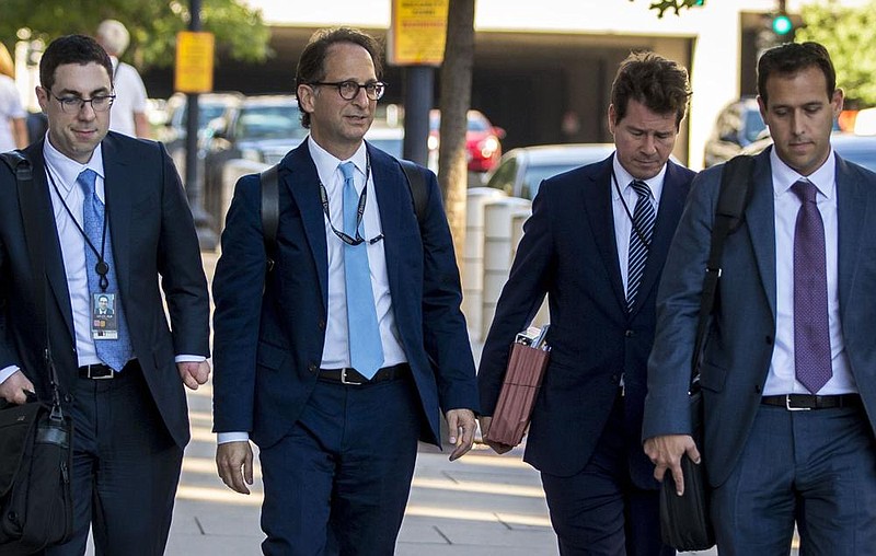 FILE â€” Andrew Weissmann, second from left, with other prosecutors and investigators working with Special Counsel Robert Mueller, in Washington, Sept. 20, 2017. Weissmann, who helped lead the cases against the former Trump campaign officials Paul Manafort and Rick Gates, is reportedly leaving the team soon, another signal that the inquiry is winding down. (Al Drago/The New York Times)