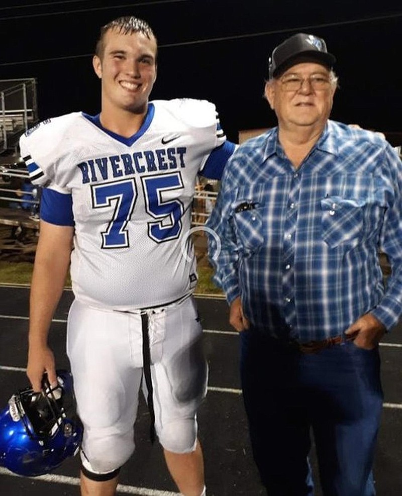 University of Arkansas offensive line commitment Cole Carson (left), 6-6, 285 pounds, of Bogata (Texas) Rivercrest, spends his time off the eld with his grandfather Sonny Belcher working on a ranch they co-own. 
(Submitted photo) 

