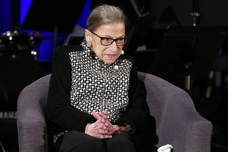 FILE - In this Dec. 17, 2019, file photo Supreme Court Justice Ruth Bader Ginsburg speaks with author Jeffrey Rosen at the National Constitution Center Americas Town Hall at the National Museum of Women in the Arts in Washington. (AP Photo/Steve Helber, File)