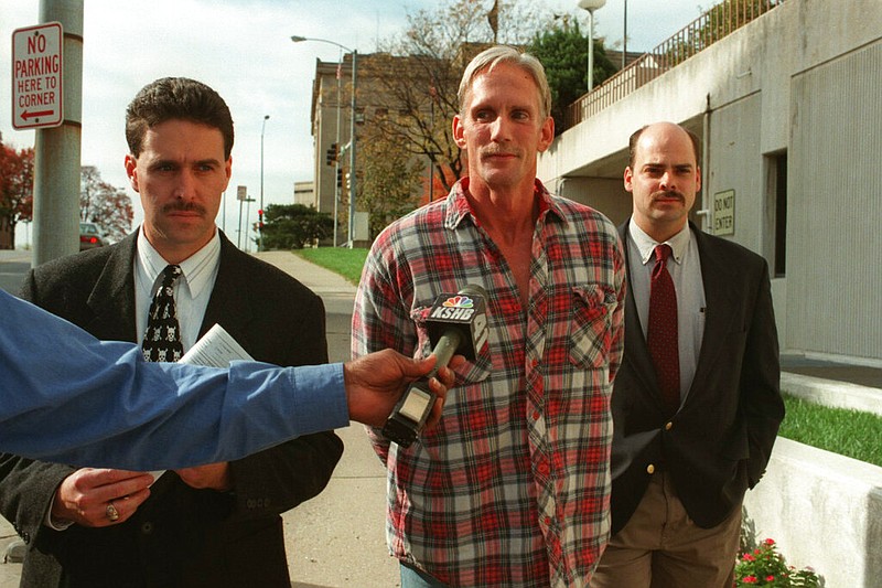 In this 1998 photo, Wesley Ira Purkey, center, is escorted by police officers in Kansas City, Kan., after he was arrested in connection with the death of 80-year-old Mary Ruth Bales. Purkey was also convicted of kidnapping and killing a 16-year-old girl.