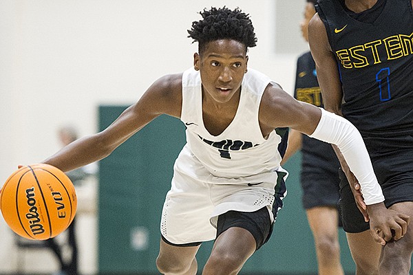 Little Rock Christian guard Layden Blocker (1) dribbles down the court during a game against E-Stem at the Wildcat Classic Championship game in Little Rock on Saturday, Dec. 28, 2019.