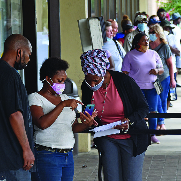 People wait in line to file unemployment claims Thursday at the Arkansas Workforce Center in Little Rock.
(Arkansas Democrat-Gazette/Staci Vandagriff)