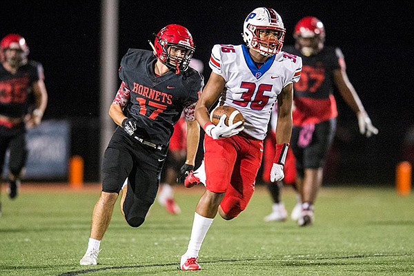 Little Rock Parkview tight end Erin Outley (36) runs away from a Maumelle defender during a game Friday, Oct. 4, 2019, at Hornet Stadium in Maumelle.