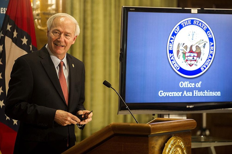 Gov. Asa Hutchinson said Friday that he did not take issue with law enforcement officials’ decisions on mask enforcement, as they are “subject to local priorities.” More photos at arkansasonline.com/718gov/.
(Arkansas Democrat-Gazette/Stephen Swofford)