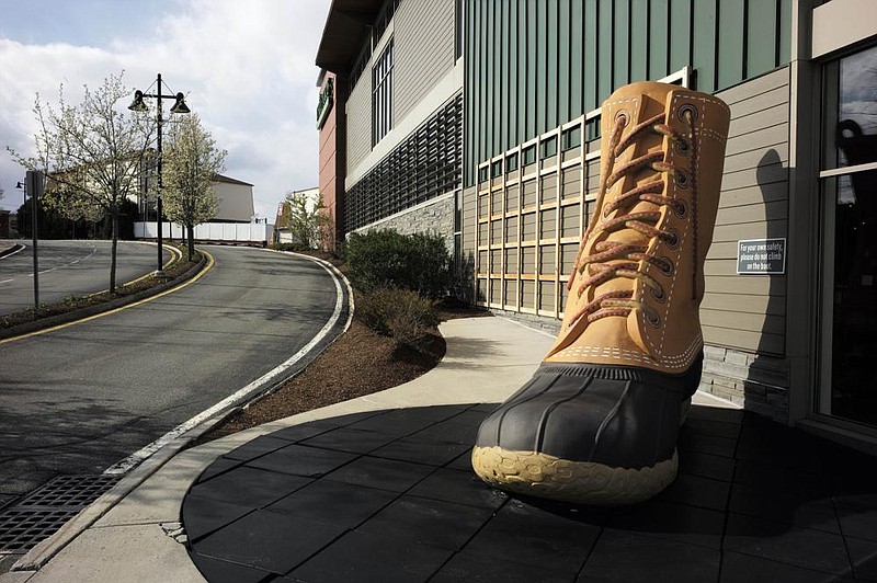 An oversize boot stands outside an L.L. Bean store in Dedham, Mass. L.L. Bean’s new agreement with retailers is a push to get more of its products in front of consumers.
(AP)