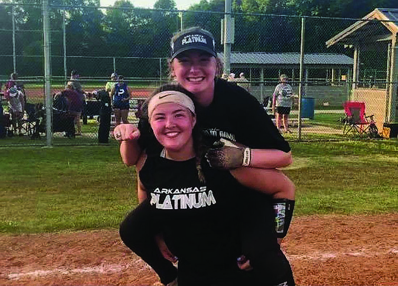 El Dorado softball players Raielynn Fudge (top) and Cammie Gadberry enjoy competing for Arkansas Platinum this summer. The sophomores-to-be have been busy honing their skills for next season's high school competition.